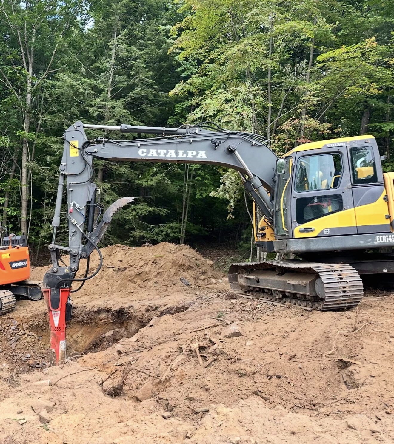Catalpa Carpentry excavator digging a foundation
